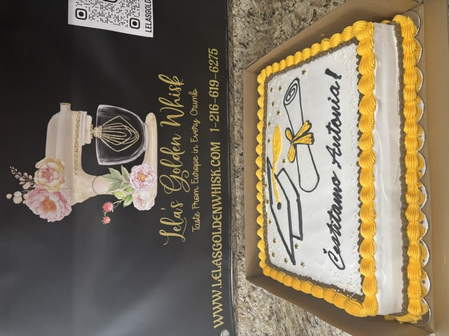 Graduation cake with a piped cap and diploma design