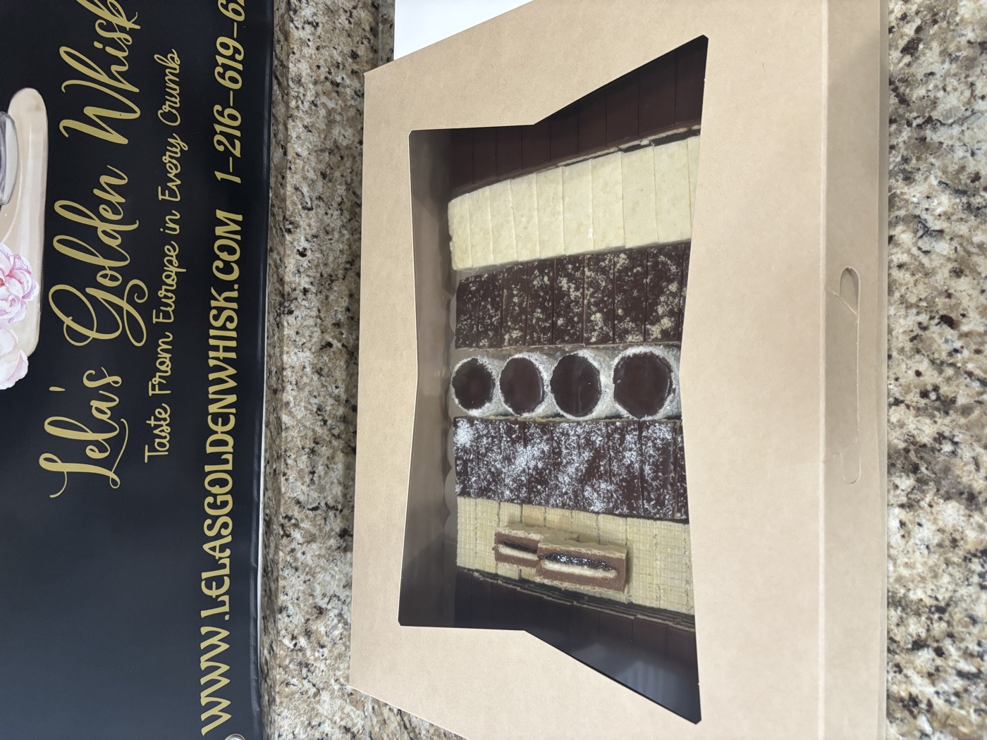 A windowed gift box of assorted pastries