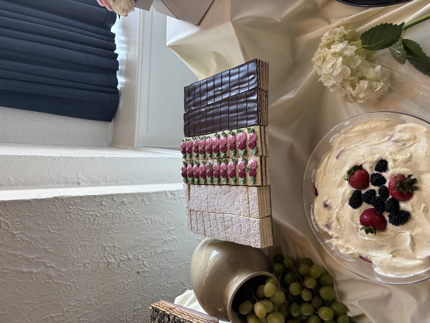 Colorful pastry bars arranged on a dessert table