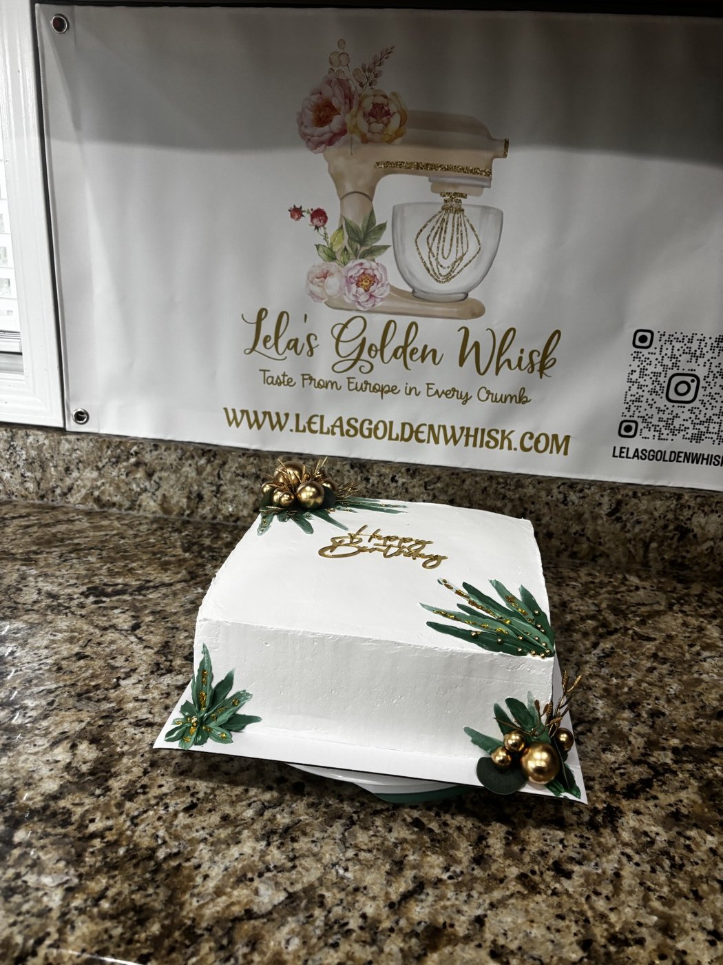 White cake with greenery