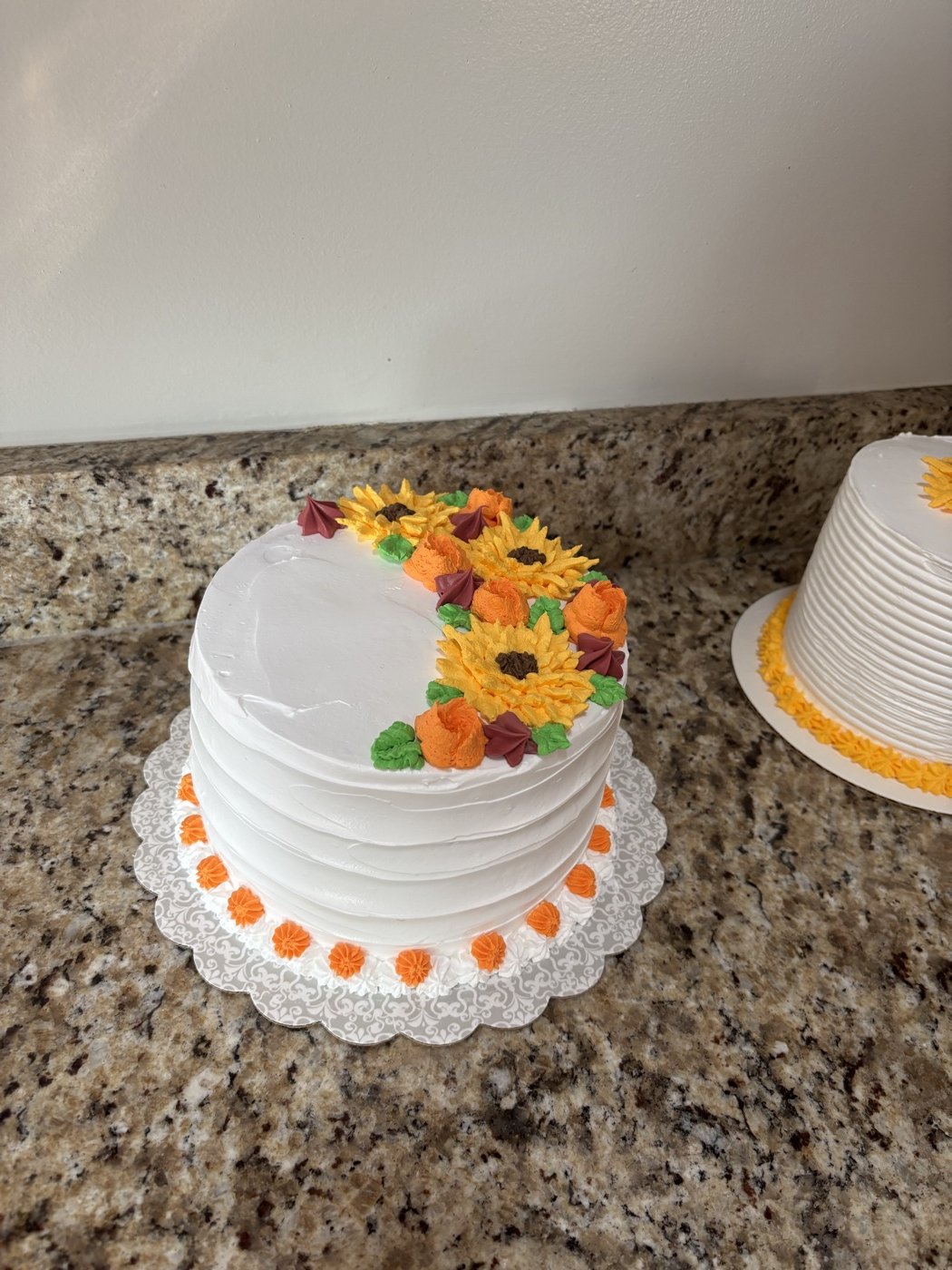 White cake with colorful flowers