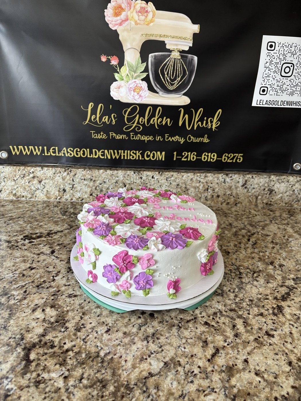 A round floral celebration cake