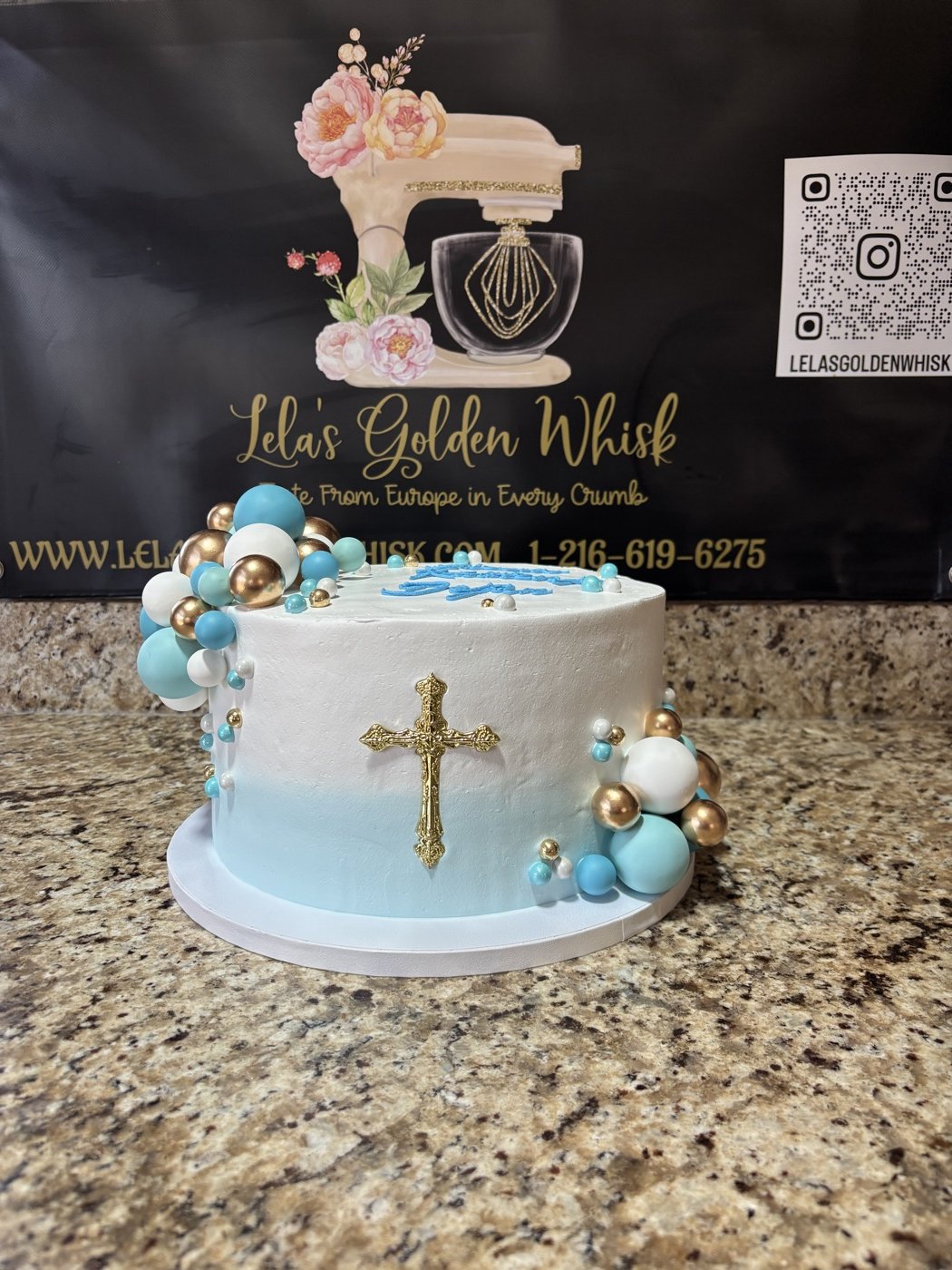 Blue cake with a gold cross