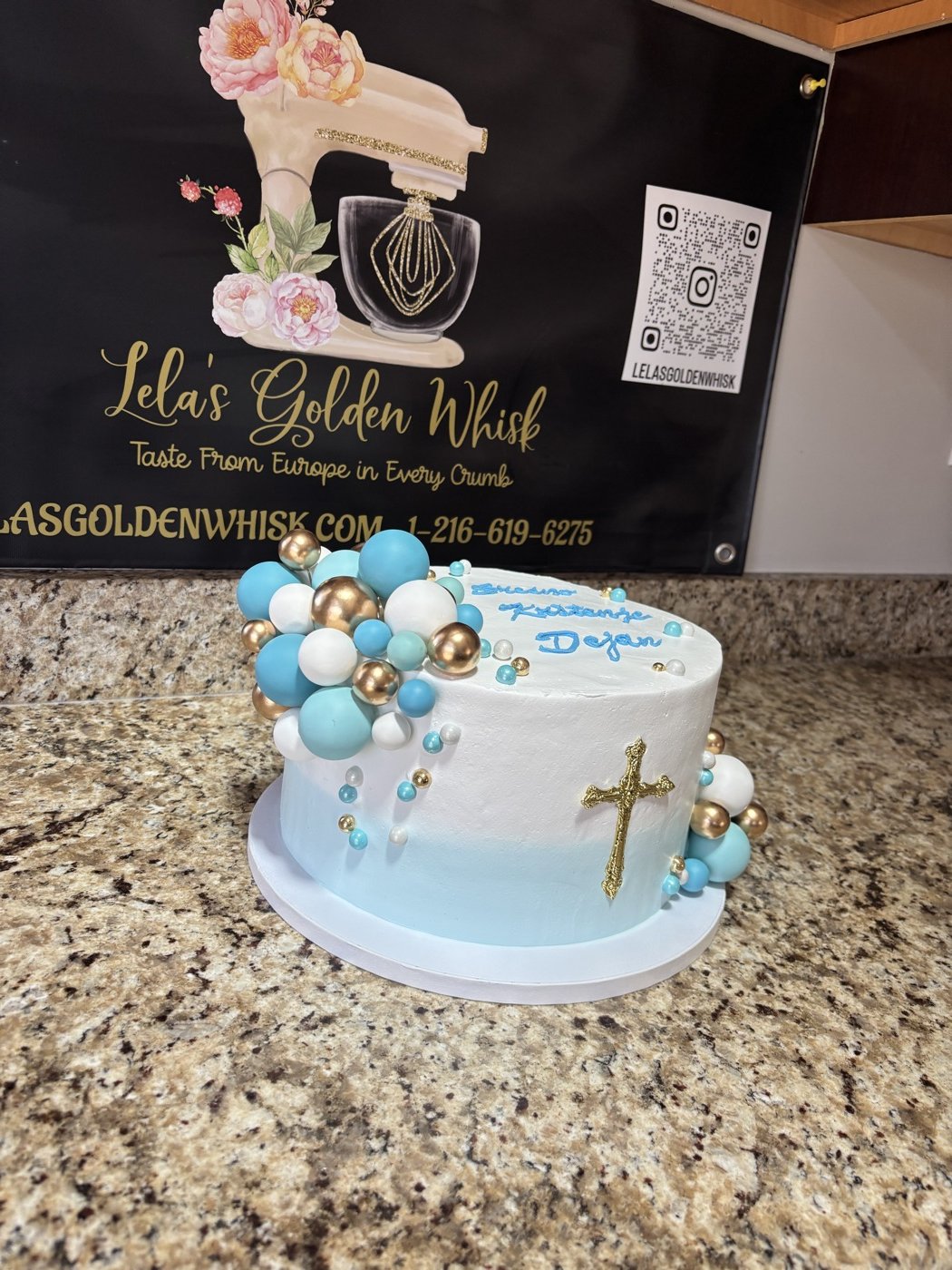Blue cake with decorative spheres