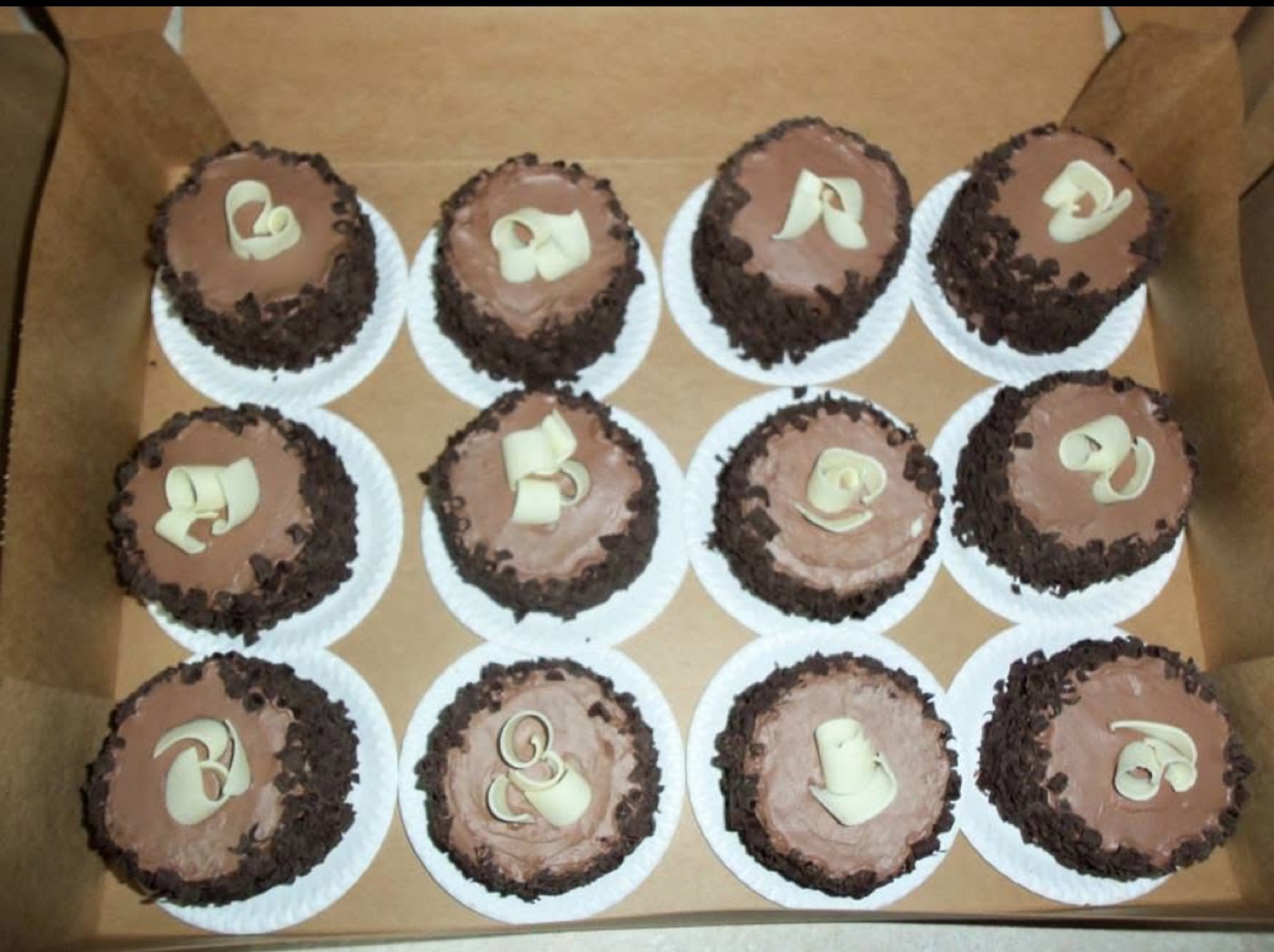Chocolate cupcakes with cream topping