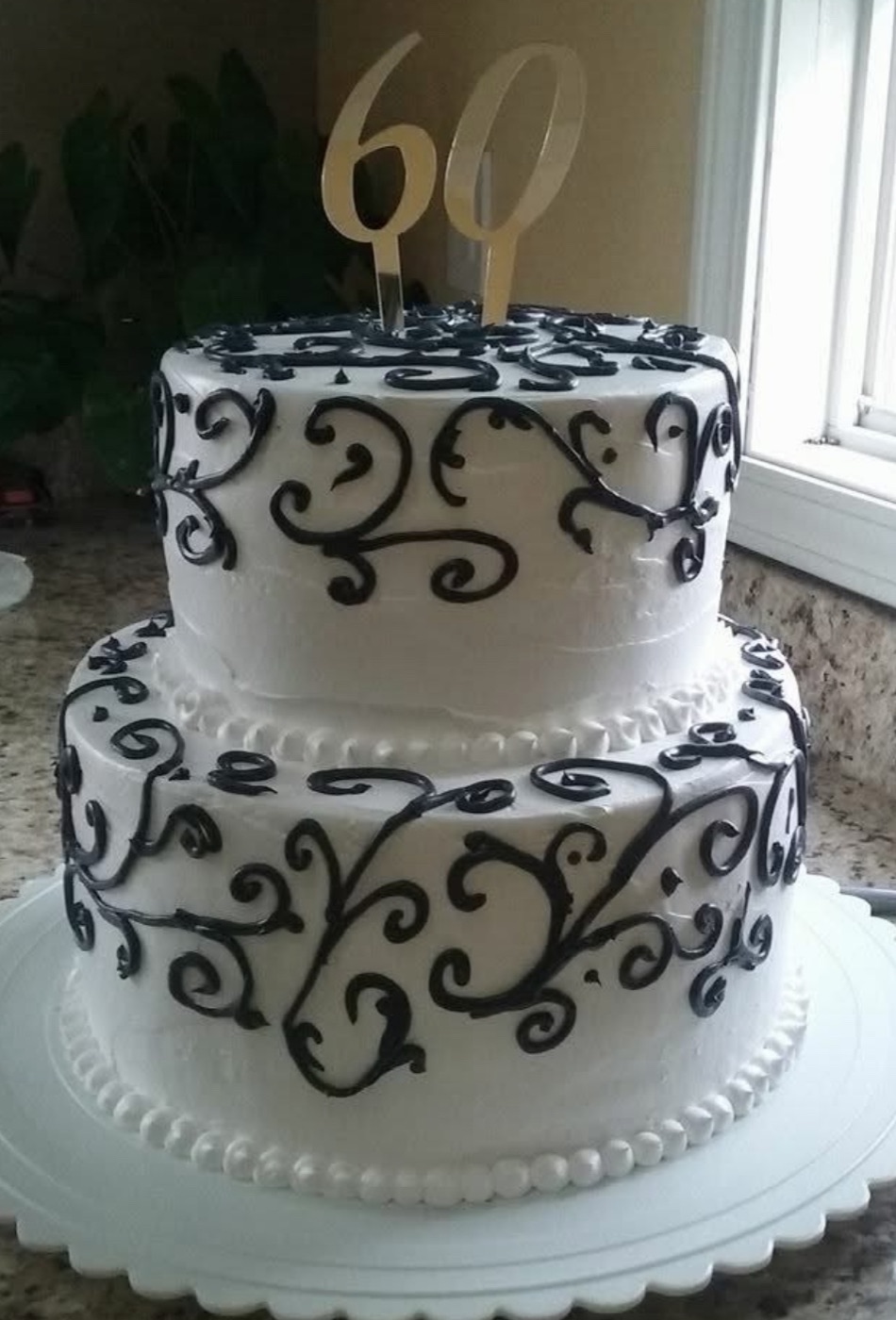 Black and white tiered birthday cake