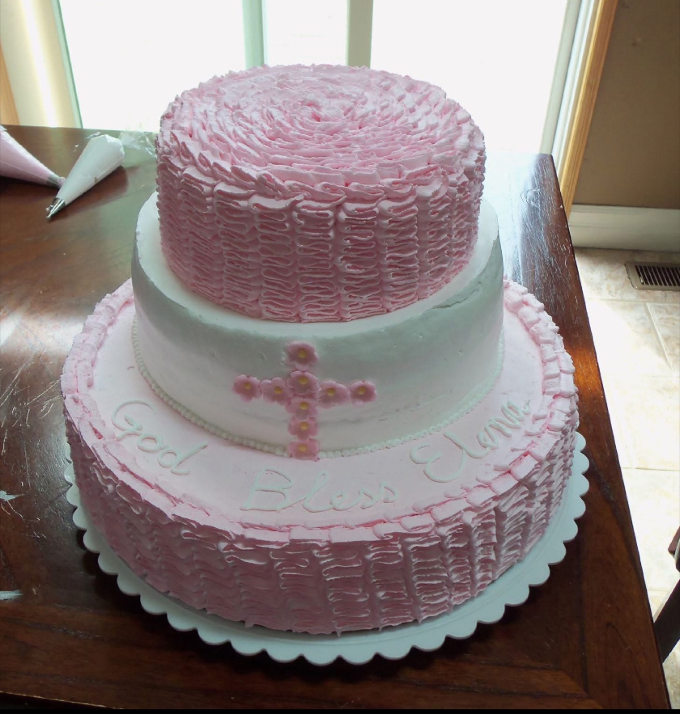 Pink and white tiered cake