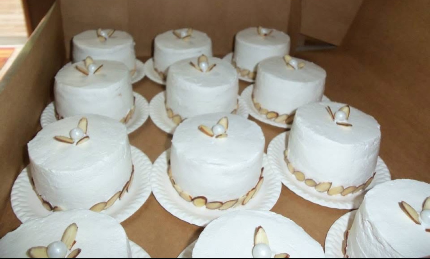 Miniature white tiered cakes