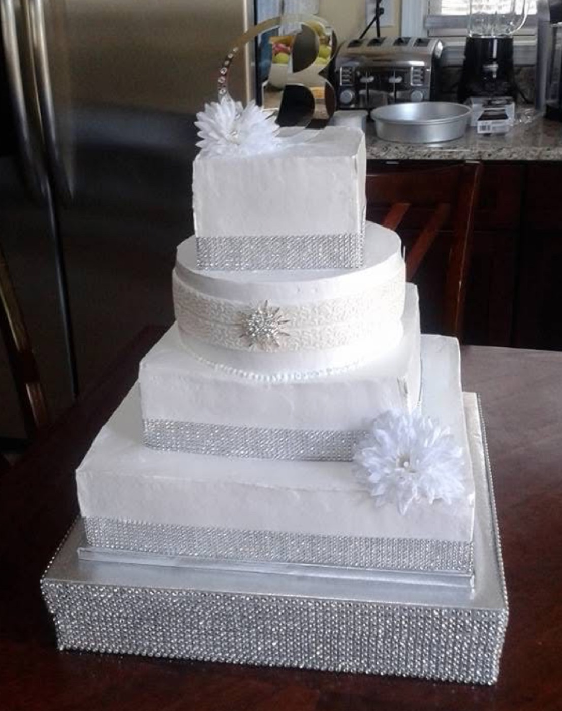 White tiered cake with a bow