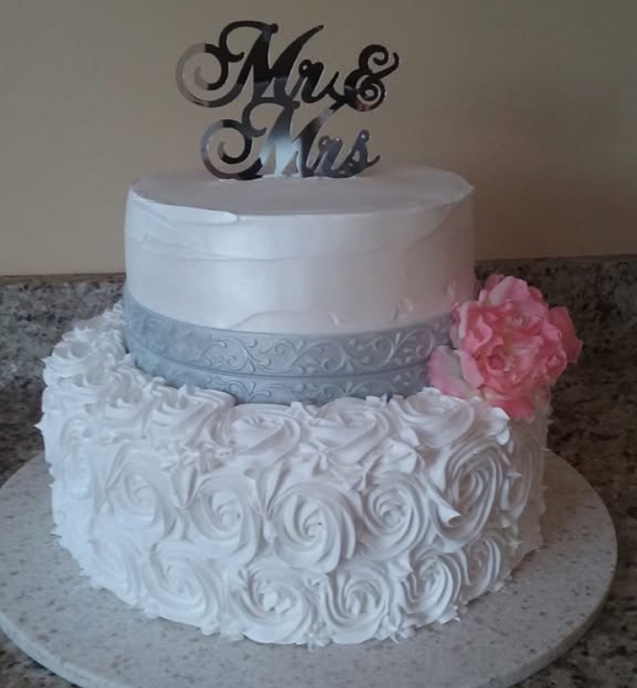 White wedding cake with pink flowers